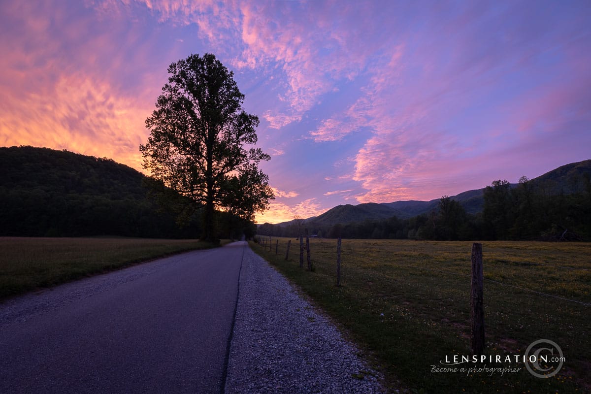 Landscape photography capturing sunrise over road at Cades Cove, Tennessee, Smokey Mountain National Park