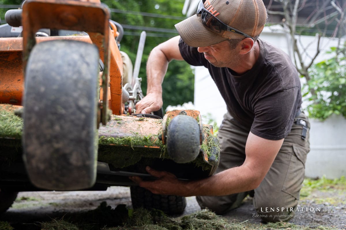 Photo assignment man working on lawn mower