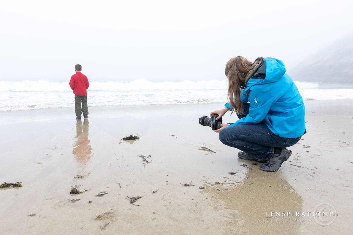 Photographer at Sand Beach in Acadia National Park in Maine