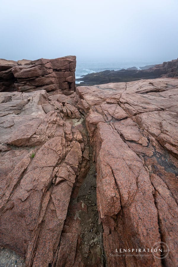 Rocks form leading lines for landscape photography at Acadia National Park in Maine, USA