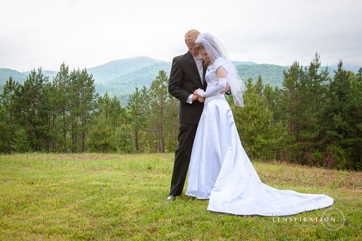 Outdoor wedding shot with mountains in background
