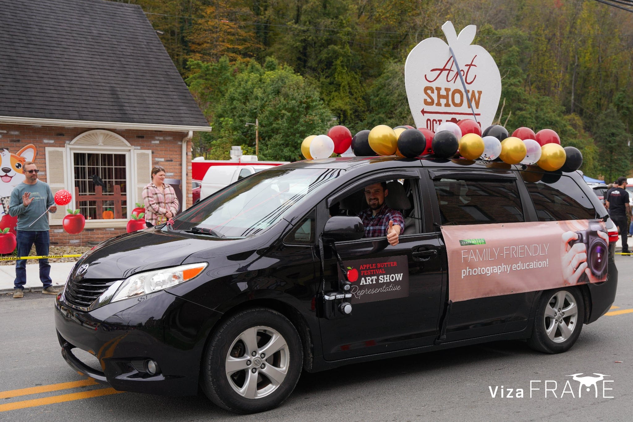 Lenspiration's Art Show float in the 2026 Apple Butter Festival parade in Salem, West Virginia